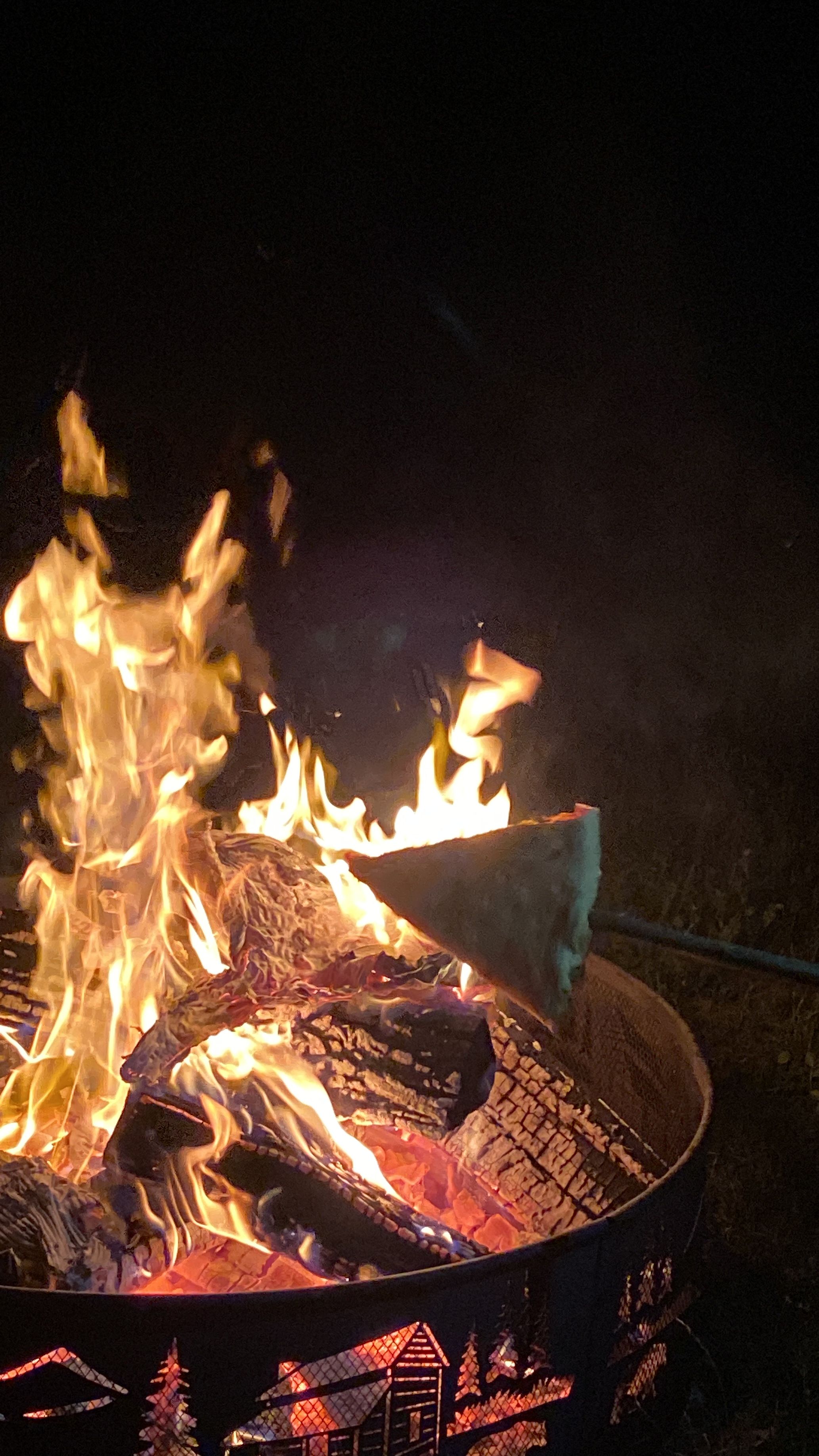 Campfire with pizza at FLX Glamping — fire rings provided at every site