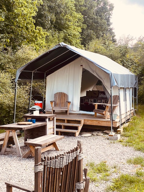 Sublime Wild Vine safari tent entrance with outdoor seating at FLX Glamping